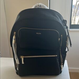 Tumi Black Backpack with Gold Zippers